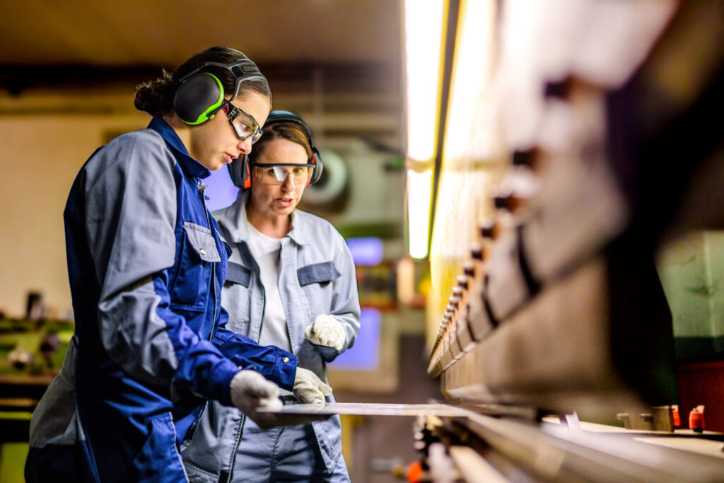 instructor showing student how to work on industrial applications