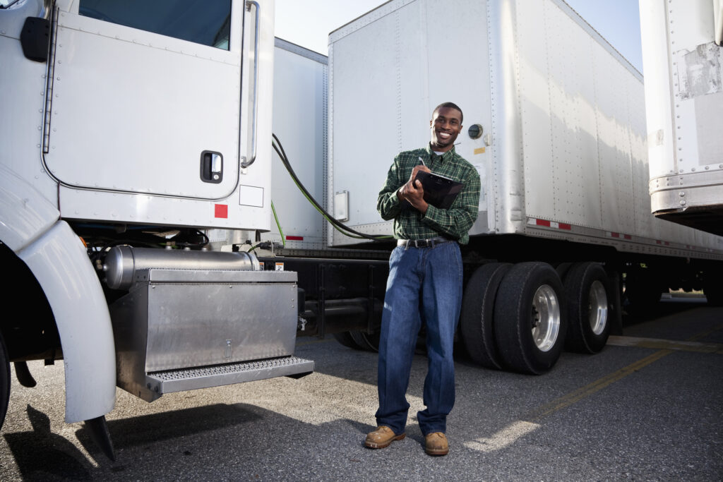truck driver doing pre-start checklist for safety